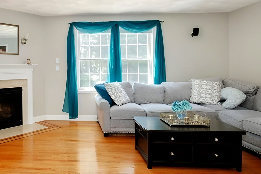Gray-couch-with-teal curtains