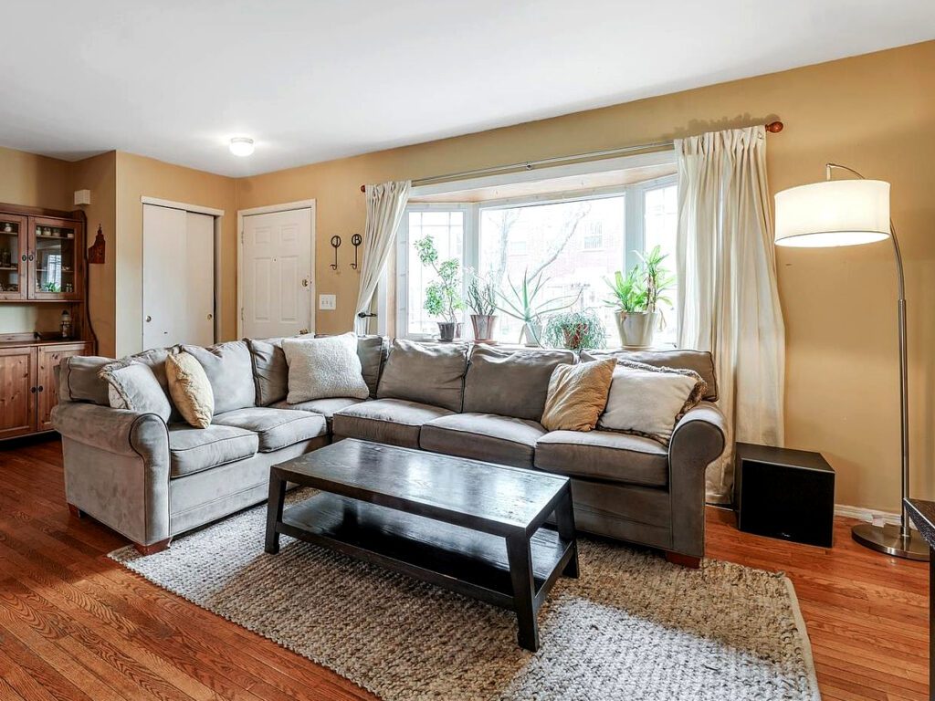 Gray-couch-with-white curtains